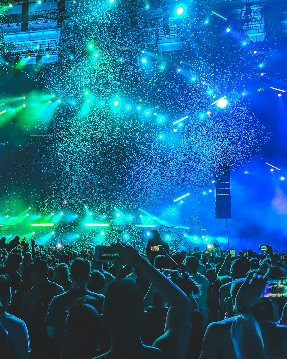 Vivid stage lighting and LED effects over an audience